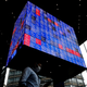 A man walks under an electronic screen showing Japan’s Nikkei share price index inside a conference hall in Tokyo, Japan June 14, 2022. REUTERS/Issei Kato